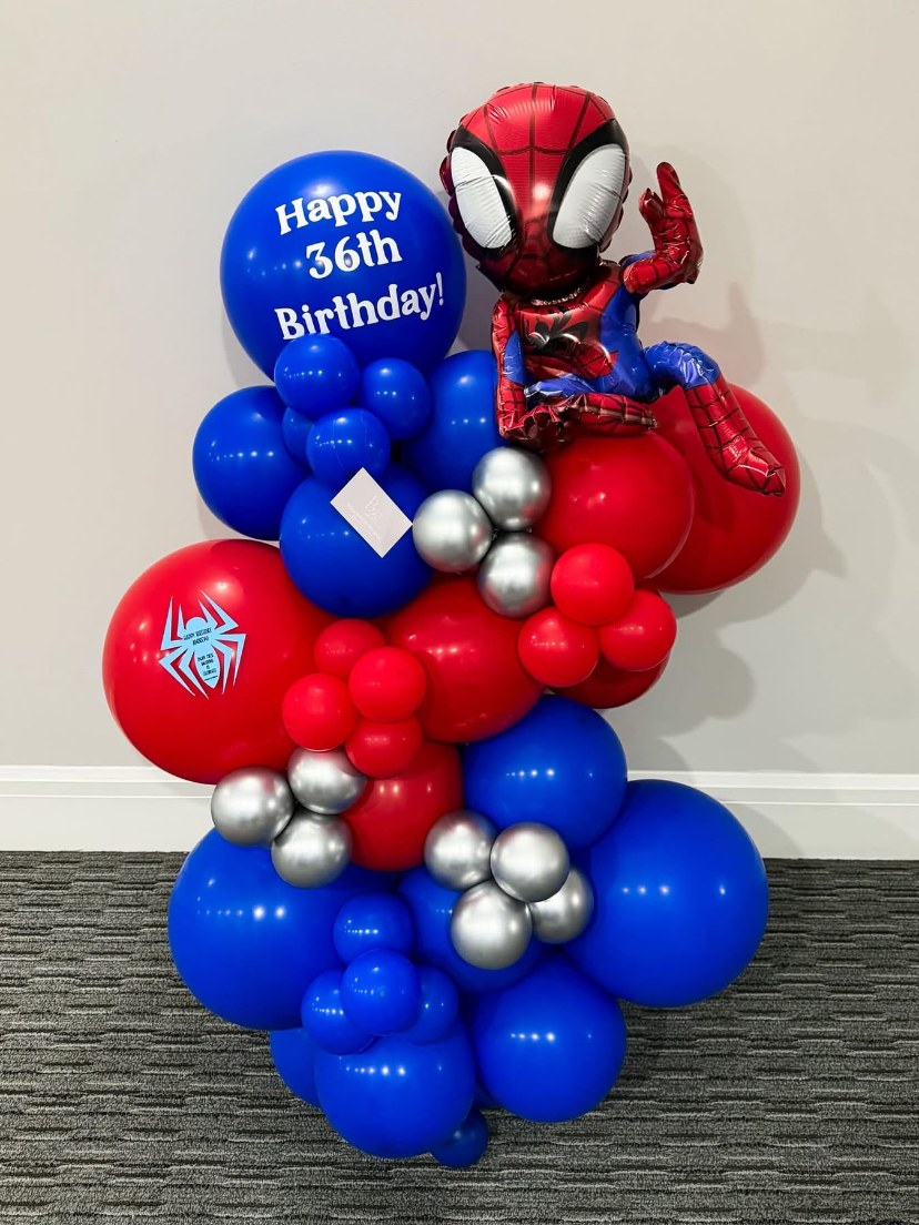 Red and blue superhero birthday balloon arrangement